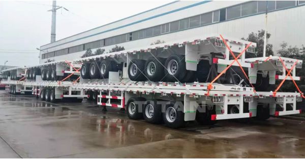 Multi types of flatbed trailers. Tri axle trailer, container tipper and extendable flatbed trailer
